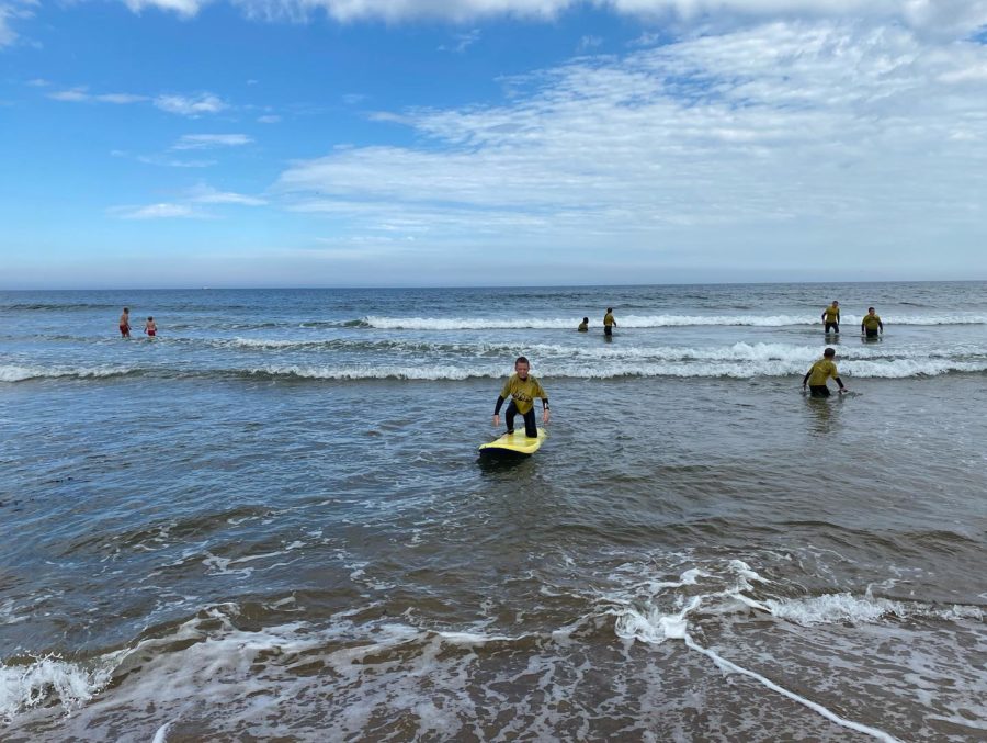 Young people surfing on the coast of Sunderland