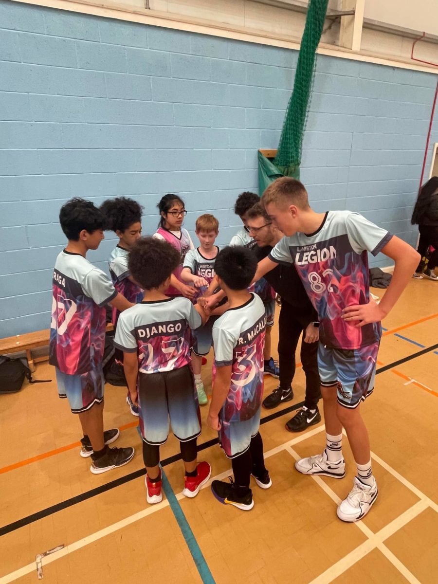 Group of young people playing basketball